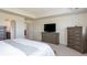Serene main bedroom with tray ceilings and ample closet space, plus ensuite bath access at 8761 S Wenatchee Ct, Aurora, CO 80016