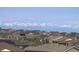 A view of a neighborhood with gorgeous mountain views in the background at 8761 S Wenatchee Ct, Aurora, CO 80016