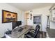 Well-appointed home office with a decorative desk, shelving, and a comfortable desk chair at 8761 S Wenatchee Ct, Aurora, CO 80016