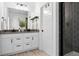 Sleek bathroom featuring a dual vanity, black fixtures, and modern shower at 12261 Farmview St, Thornton, CO 80241
