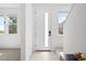 Bright entryway featuring a modern door and windows with natural light at 12261 Farmview St, Thornton, CO 80241