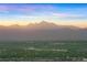 Expansive view of majestic mountains in the distance, creating a breathtaking backdrop for the neighborhood at 12261 Farmview St, Thornton, CO 80241