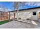Backyard patio features a wood deck, concrete area, wooden fence, and artificial turf at 3502 S Kittredge St # C, Aurora, CO 80013