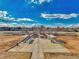 Aerial view of a baseball field surrounded by trees and the cityscape at 3502 S Kittredge St # C, Aurora, CO 80013