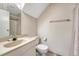 Bathroom with a single sink, toilet, and shower with shower curtain, neutral wall color, and tile flooring at 3502 S Kittredge St # C, Aurora, CO 80013