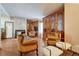 Inviting living room with a fireplace, wood floors, and elegant built-in cabinetry at 3502 S Kittredge St # C, Aurora, CO 80013