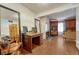 Bright home office with a beautiful wooden desk next to the fireplace and living room at 3502 S Kittredge St # C, Aurora, CO 80013