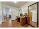 Bright office space with a wooden desk and views into the rest of the house at 3502 S Kittredge St # C, Aurora, CO 80013