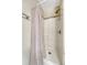Bathroom stall featuring basic fixtures and shower curtain at 3502 S Kittredge St # C, Aurora, CO 80013