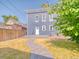 Backyard featuring gray siding, green grass, stone walkway at 541 Fox St, Denver, CO 80204