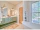 Well-lit bathroom showcasing double vanity, modern tub and fixtures, and a warm, inviting space at 541 Fox St, Denver, CO 80204