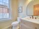 Bathroom featuring tile floor, new vanity, and large window at 541 Fox St, Denver, CO 80204