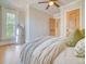 Bedroom featuring hardwood floors, large window, and a mirror at 541 Fox St, Denver, CO 80204
