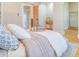 Cozy bedroom with bed featuring neutral linens, wood floors, and an ensuite entrance at 541 Fox St, Denver, CO 80204