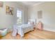 Charming bedroom featuring a single bed, natural light from the window and decor on the wall at 541 Fox St, Denver, CO 80204