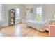 Bright bedroom featuring a bed with floral patterned bedding and two windows with natural light at 541 Fox St, Denver, CO 80204