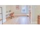 Bright bedroom featuring hardwood floors, a large window, and a stylish desk at 541 Fox St, Denver, CO 80204