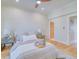 Bedroom featuring a bed with neutral linens, wood floors, and an ensuite entrance at 541 Fox St, Denver, CO 80204