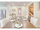 Dining room with hardwood floors, great light, and views to the kitchen and stairs at 541 Fox St, Denver, CO 80204
