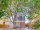 Charming two-story home with large trees and landscaped yard at 541 Fox St, Denver, CO 80204