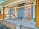 Inviting front porch with seating, charming decor, and stylish architectural details at 541 Fox St, Denver, CO 80204