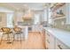 Bright, eat-in kitchen with white cabinets, stainless steel appliances, and a breakfast bar at 541 Fox St, Denver, CO 80204