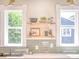 Beautiful kitchen design with open shelving, green tile backsplash, and modern fixtures at 541 Fox St, Denver, CO 80204