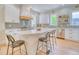 Bright, open kitchen featuring a large island, stainless steel appliances, and custom cabinetry at 541 Fox St, Denver, CO 80204