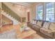 Bright living room with hardwood floors, large windows, and cozy seating arrangement at 541 Fox St, Denver, CO 80204