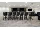 This bar includes seating, with elegant countertops and multiple flatscreen televisions at 420 N Colorado Blvd, Denver, CO 80206