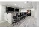 This bar includes seating, with elegant countertops and multiple flatscreen televisions at 420 N Colorado Blvd, Denver, CO 80206