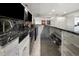Basement bar area featuring granite countertops, updated appliances, and custom cabinetry, perfect for entertaining guests at 420 N Colorado Blvd, Denver, CO 80206