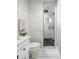 Modern bathroom with white marble tiles, glass-enclosed shower, and sleek fixtures for a spa-like feel at 420 N Colorado Blvd, Denver, CO 80206