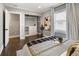 Bright bedroom featuring hardwood floors, a walk-in closet, and serene decor, offering a peaceful retreat at 420 N Colorado Blvd, Denver, CO 80206