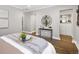 Serene bedroom featuring hardwood floors, neutral walls, stylish decor, and organized storage spaces at 420 N Colorado Blvd, Denver, CO 80206