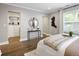 Stylized bedroom with organized closet, hardwood floors, neutral walls, and natural light at 420 N Colorado Blvd, Denver, CO 80206