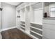 Organized walk-in closet with built-in shelving and drawers, offering ample storage space at 420 N Colorado Blvd, Denver, CO 80206