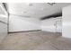 Spacious garage with overhead lighting, white walls and concrete floor at 420 N Colorado Blvd, Denver, CO 80206
