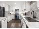 Modern kitchen with stainless steel appliances, granite countertops, and wood flooring at 420 N Colorado Blvd, Denver, CO 80206