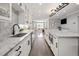 Bright, modern kitchen featuring marble countertops, and stainless steel appliances, open to living spaces at 420 N Colorado Blvd, Denver, CO 80206