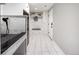 Well-organized mudroom with bench seating, built-in storage, and marble tiling, perfect for entry and storage at 420 N Colorado Blvd, Denver, CO 80206