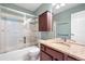 Bathroom featuring a shower with sliding glass doors, vanity, and a large mirror at 3102 White Oak Trl, Highlands Ranch, CO 80129