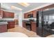 Functional kitchen featuring dark wood cabinets, neutral countertops and stainless steel appliances at 3102 White Oak Trl, Highlands Ranch, CO 80129