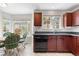 Bright kitchen showcasing ample countertop space, natural light, and an adjacent breakfast nook at 3102 White Oak Trl, Highlands Ranch, CO 80129