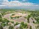 An aerial view of Green Mountain High School showing the athletic fields and the neighborhood at 1811 S Yank Ct, Lakewood, CO 80228