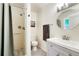 Cozy bathroom features a shower, commode, and vanity sink at 1811 S Yank Ct, Lakewood, CO 80228