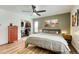 Bedroom showcasing an open closet, hardwood floors, and a ceiling fan at 1811 S Yank Ct, Lakewood, CO 80228