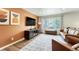Cozy living room showcasing a large window, warm color palette, and comfortable seating at 1811 S Yank Ct, Lakewood, CO 80228