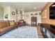 Open-concept living space with wood floors, comfortable furniture, and stylish accents at 1811 S Yank Ct, Lakewood, CO 80228