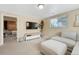 Inviting living room with plush seating, natural light, and access to the bedroom at 1811 S Yank Ct, Lakewood, CO 80228